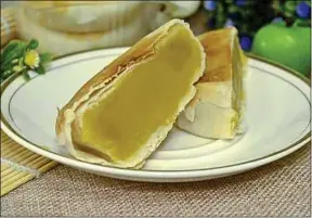  ??  ?? Gâteau à base de durian, fruit asiatique réputé pour sa mauvaise odeur.