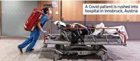  ?? ?? A Covid patient is rushed into hospital in Innsbruck, Austria