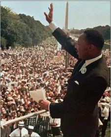  ?? ASSOCIATED PRESS ?? Dr. Martin Luther King Jr. acknowledg­es the crowd at the Lincoln Memorial for his “I Have a Dream” speech during the March on Washington, D.C. on Aug. 28, 1963.