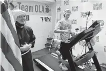  ??  ?? In this Aug. 23 photo, Sister Stephanie Baliga, right, runs a marathon on a treadmill in the basement of Mission of Our Lady of the Angels church in Chicago. [PJ WEILAND/VIA AP]