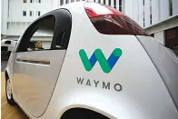  ?? AP Photo/Eric Risberg, File ??    In this Dec. 13, 2016, file photo, the Waymo driverless car is displayed during a Google event in San Francisco. Uber is settling a lawsuit filed by Google’s autonomous car unit alleging that the ride-hailing service ripped off self-driving car...