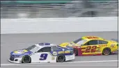  ?? ORLIN WAGNER — THE ASSOCIATED PRESS ?? Chase Elliott (9) leads Joey Logano (22) on the first lap of a NASCAR Cup Series auto race at Kansas Speedway in Kansas City, Kan., Sunday.