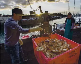  ?? KARL MONDON – STAFF ARCHIVES ?? The New Easy Rider unloads its haul of Dungeness crab on Dec. 15, 2019, on Pier 45 in San Francisco.