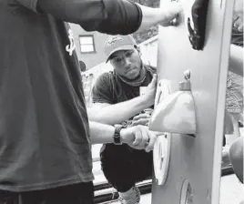  ?? KIM HAIRSTON/BALTIMORE SUN ?? Ravens cornerback Marlon Humphrey spends a day off with other volunteers building a playground at Douglass Homes last year.