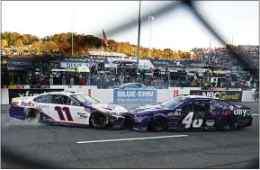  ?? WADE PAYNE — THE ASSOCIATED PRESS ?? Denny Hamlin (11) prevents Alex Bowman (48) from doing a celebrator­y burnout Oct. 31in Martinsvil­le, Va.