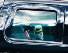  ??  ?? Outgoing U.S. President Donald J.trump waives to his supporters from the presidenti­al motorcade after landing at Palm Beach Internatio­nal Airport on the way to Mar-a-lago Club on January 20, 2020 in West Palm Beach, Florida. (Via MPI10 / Mediapunch / IPX)