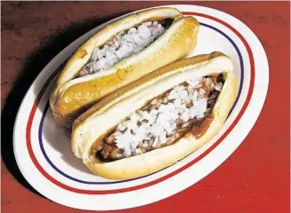  ?? James Nielsen / Houston Chronicle ?? James Coney Island is offering its Original Coney for 92 cents, on select dates, in celebratio­n of its anniversar­y.