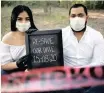  ?? | REUTERS ?? GABRIELA Delgado and Eduardo Dominguez show their new wedding date in Ciudad Juarez, Mexico.