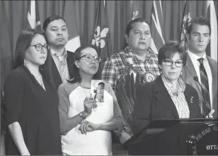  ?? The Canadian Press ?? Senator Kim Pate stands with advocates and family members of Colten Boushie as she speaks during a press conference on Parliament Hill in Ottawa on Feb. 14.