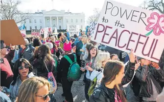  ?? PABLO MARTINEZ MONSIVAIS THE ASSOCIATED PRESS FILE PHOTO ?? Imagine a world where men were more like women, Heather Mallick writes. A lot more peaceful, a lot less stupid.