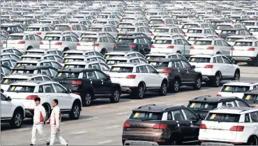 ?? PHOTO: AP ?? Haval SUV models parked outside the Great Wall Motors assembly plant in Baoding, in China’s northern Hebei province. China’s factory activity grew last month, surveys yesterday showed, adding to recent evidence that a key sector of the world’s...