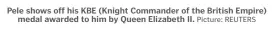  ?? Picture: REUTERS ?? Pele shows off his KBE (Knight Commander of the British Empire)
medal awarded to him by Queen Elizabeth II.