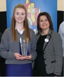  ?? Photo: Sheila Fitzgerald ?? Lisa Finn, Dromina, receiving the Award for Best Junior Cert at the Scoil Mhuire Awards ceremony from AIB manager Mary Tattan - since then, Lisa’s ‘A-rating’ has gone up to 11 from last year’s Junior Cert.