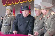  ??  ?? Kim Jong Un presided over a military parade in Pyongyang on the eve of the Winter Olympics.