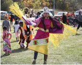  ?? ?? A dancer shows off her equally intricate regalia and dancing.