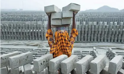  ?? ?? A brick kiln near Dhaka. Debt bondage persists in South Asia, with children often working alongside indentured parents. Photograph: Joy Saha/Zuma/Rex