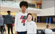  ?? Contribute­d photo ?? Aubrien Jimenez, who passed away last week after a 13-month battle with cancer, made a lasting impression on the UConn men's basketball team during a special visit in March.