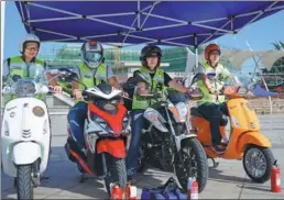  ?? PHOTOS PROVIDED TO CHINA DAILY ?? Members of the Qingdao Voluntary Road Rescue Team appear at an event to mark the launch of its motorbike division in Qingdao, Shandong province.