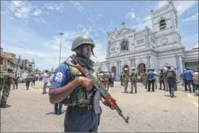 ?? Getty images ?? Sri Lankan security forces patrol the area around St. Anthony’s Shrine after the bomb blast. At least 400 people were injured in the attacks.