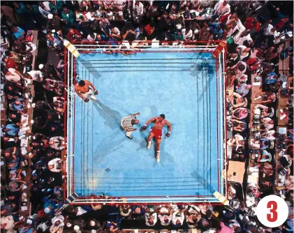  ?? GETTY IMAGES ?? Floored: Ali watches on as Foreman is counted out to end the ‘Rumble in the Jungle’ 3