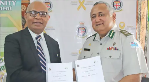  ?? Photo: ?? Seventh-day Adventist Church Fiji chairman Pastor Talemo Cakobau and Fiji Correction­s Service Commisione­r Commander Francis Kean during the Memorandum of Understand­ing signing on July 14, 2020.