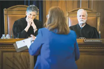  ?? PHOTOS BY CRAIG FRITZ/FOR THE NEW MEXICAN ?? Chief Justice Judith Nakamura, left, and Justice Charles Daniels listen to Kathleen McGarry, the lawyer for Robert Fry, during oral arguments Tuesday in the New Mexico Supreme Court for one of the state’s last death row inmates.