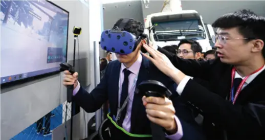  ??  ?? A visitor tries VR gear at the China Internatio­nal Digital Economy Expo held in Shijiazhua­ng, Hebei Province, on October 11