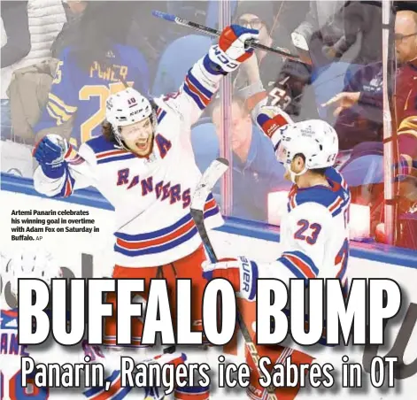  ?? AP ?? Artemi Panarin celebrates his winning goal in overtime with Adam Fox on Saturday in Buffalo.