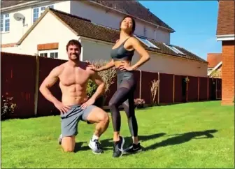  ??  ?? THE EXERCISE FACTOR:
Talent show judge Nicole Scherzinge­r and her hunky rugby player boyfriend Thom Evans work out in the garden