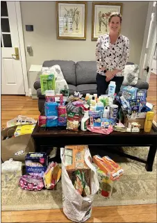  ?? COURTESY OF JEPTHA ABBOTT DAR ?? Joyce Keller, the Jeptha Abbott DAR chapter’s Women’s Issues chair with the donations collected for Laurel House by Jeptha Abbott DAR members.