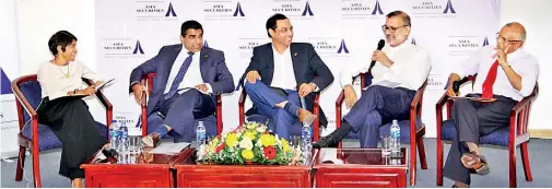  ??  ?? At the panel discussion. From left: Mangalee Goonetille­ke, Vice President – Research, Asia Securities (moderator); Ruwan Waidyaratn­e, Managing Director, Hayleys Advantis Ltd; Jagath Pathirane, CEO, Expolanka Freight (Pvt) Ltd; Ajit Gunewarden­e, Chairman, PickMe and Tissa Wickremasi­nghe, COO, Hambantota Internatio­nal Port Group (Pvt) Ltd.