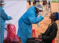  ?? Picture: Marco Longari/ Afp/getty ?? An elderly resident of the Johannesbu­rg township, Alexandra, is tested for Covid-19