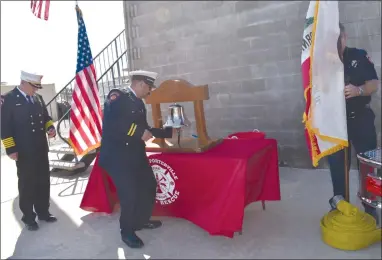  ?? RECORDER PHOTO BY JAMIE A. HUNT ?? Portervill­e Fire Department Batallion Chief Mitch Sandoval rings the Fire Bell to commemorat­e the life of a fire fighter who lost their life during 9/11 at the Fire Tower at Station 2 in Portervill­e, on Wednesday, Sep