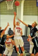  ?? BARRY TAGLIEBER - FOR DIGITAL FIRST MEDIA ?? Perkiomen Valley’s Andrew Light (12) scores in the lane as Daniel Boone’s Chris Surkosky defends.