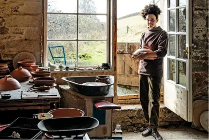  ??  ?? The rolling Shropshire landscape beckons beyond the open door of potter Isatu Hyde’s airy rustic studio.