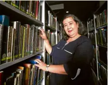  ?? —LYN RILLON ?? EDUCATION TOOLS City librarian Rose Roman with part of their book collection at Imus City public library.