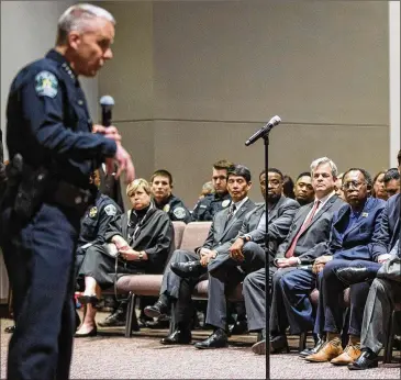  ?? TOM MCCARTHY JR. / FOR AMERICAN-STATESMAN ?? Audience members listen as interim Police Chief Brian Manley addresses the meeting. “It’s clear to everybody involved this is creating terror in our community, this is creating fear,” Manley said.