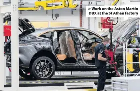  ??  ?? > Work on the Aston Martin DBX at the St Athan factory