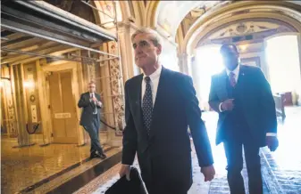  ?? J. Scott Applewhite / Associated Press ?? Special Counsel Robert Mueller began using a grand jury in federal court several weeks ago as part of his probe into possible coordinati­on between the Kremlin and the Trump campaign.