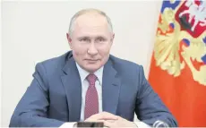  ?? AFP ?? Russian President Vladimir Putin takes part in a video conference meeting with his prime minister on transport infrastruc­ture developmen­t, on Dec 30 last year at the NovoOgaryo­vo state residence outside Moscow.