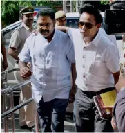  ?? — PTI ?? AIADMK leader T.T.V. Dhinakaran being produced at Tis Hazari court in New Delhi on Wednesday.