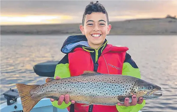  ?? Picture: CHRIS FARRUGIA ?? BIG CATCH: Charlie Farrugia was all smiles after reeling in this 2.72kg brown trout.