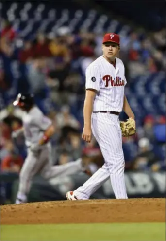  ?? DERIK HAMILTON — THE ASSOCIATED PRESS ?? Phillies starting pitcher Nick Pivetta, right, walks off the mound after giving up a solo home run to the Nationals’ Ryan Zimmerman during the fifth inning Friday in Philadelph­ia.