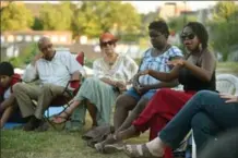  ?? DAVID BEBEE, RECORD STAFF ?? Tamon Scarlett, right, talks about her experience taking part in a protest with Black Lives Matter Toronto.