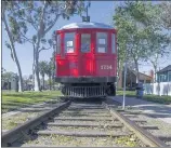  ?? PAUL BERSEBACH STAFF PHOTOGRAPH­ER ?? Pacific Electric Red Car No. 1734 has been nested outside of the Seal Beach library for about five decades. Some residents allege the couple running the Historical Society have neglected repairs.