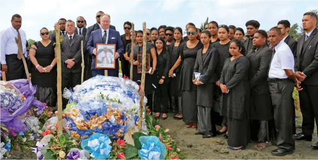  ?? Photo: ODPP ?? Director of Public Prosecutio­ns Christophe­r Pryde leads staff in paying their last respects at the funeral of the Assistant Director of Public Prosecutio­ns Mosese Korovou on July 5, 2019.