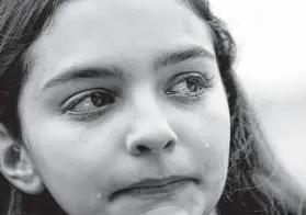  ?? Godofredo A. Vásquez / Staff photograph­er ?? Bellaire High student Paige Hoffer cries after speaking about classmate Cesar Cortes, who died Tuesday.