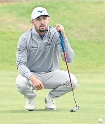  ?? ?? Marco Penge sizes up a putt on his way to a 65 at blustery Newmachar.