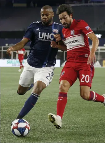  ?? BOSTON herald File ?? STEPS FORWARD: New England Revolution defender Andrew Farrell, left, looks to defend against Chicago Fire midfielder Nicolas Gaitan during the first half on Aug. 24, 2019 in Foxboro.