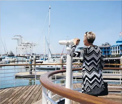  ?? Jay L. Clendenin Los Angeles Times ?? ALL THE PLEASURE CRAFT and cranes remind visitors and locals that Oakland’s port is about both work and play.